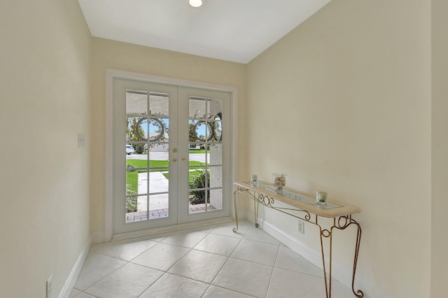 entryway with french doors, light tile patterned flooring, and plenty of natural light