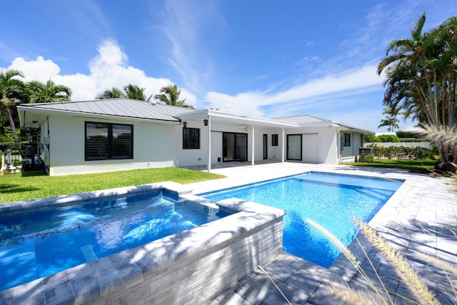 view of swimming pool with ceiling fan and a patio area