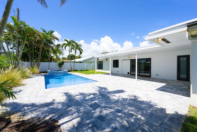 view of swimming pool with an in ground hot tub, a patio, and ceiling fan