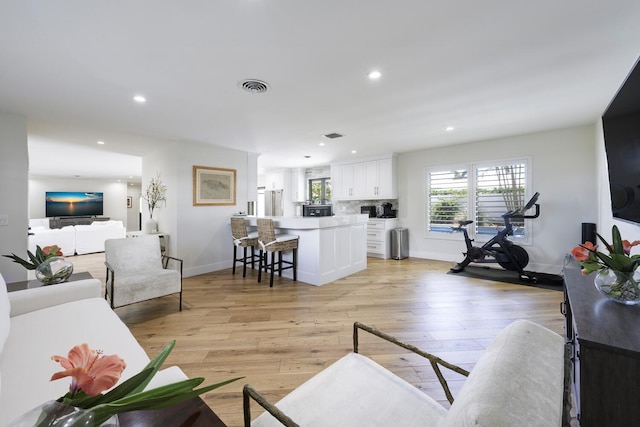 living room with light hardwood / wood-style flooring