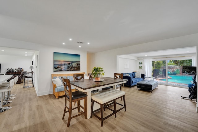 dining room with light hardwood / wood-style floors