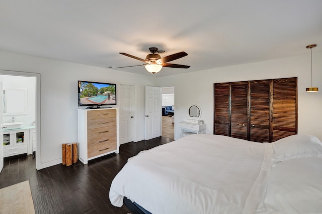 bedroom featuring ceiling fan and dark wood-type flooring