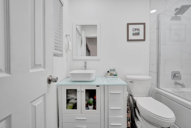 full bathroom with shower / bath combination with glass door, vanity, and toilet