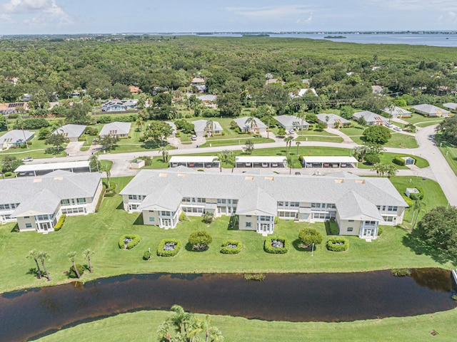 birds eye view of property featuring a water view and a residential view