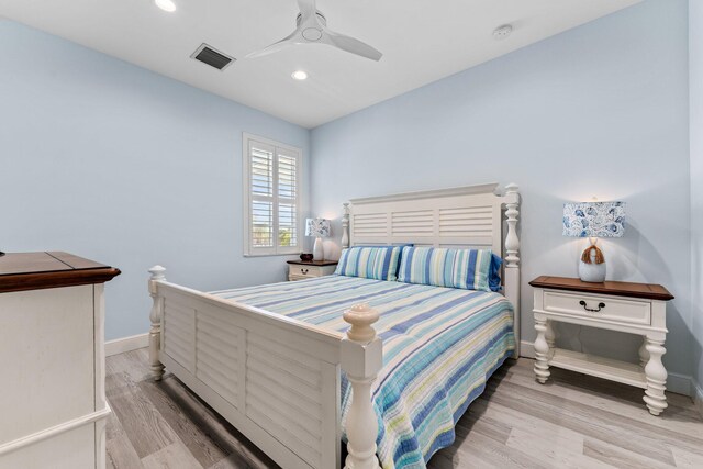 bedroom featuring light hardwood / wood-style floors and ceiling fan