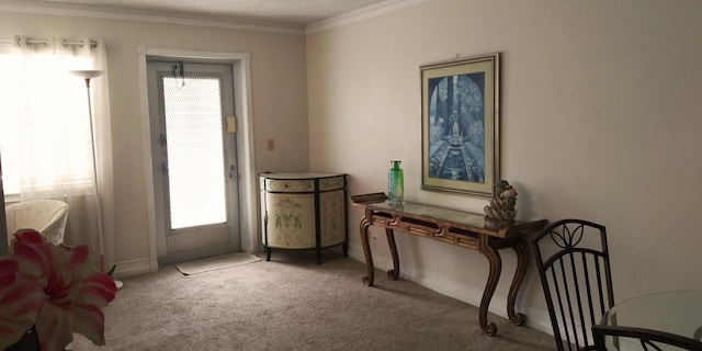 sitting room featuring crown molding and carpet