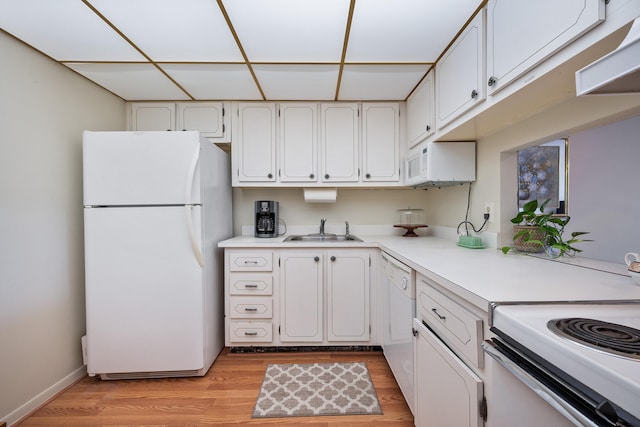 kitchen featuring sink, white appliances, white cabinetry, and light hardwood / wood-style floors