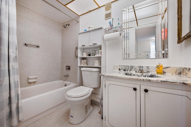 full bathroom featuring tile patterned floors, shower / bath combination with curtain, toilet, and vanity