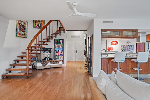 interior space featuring ceiling fan and hardwood / wood-style flooring