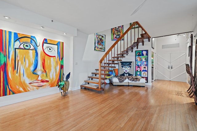 staircase featuring hardwood / wood-style flooring