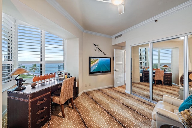 carpeted office space with ceiling fan and crown molding