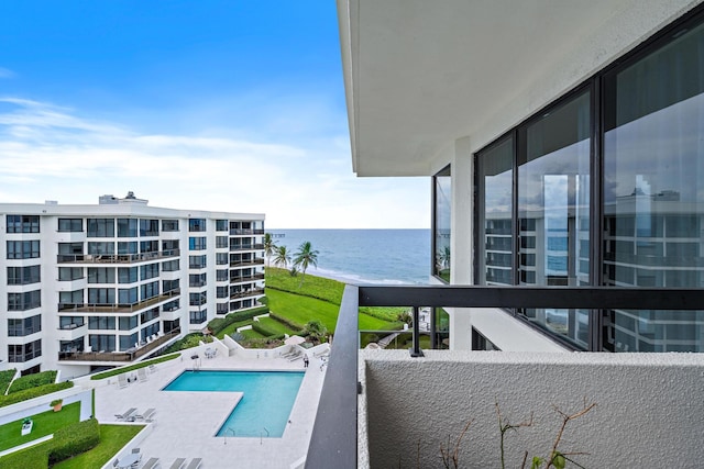 view of pool with a water view