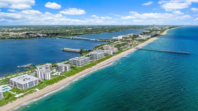 drone / aerial view with a water view and a view of the beach