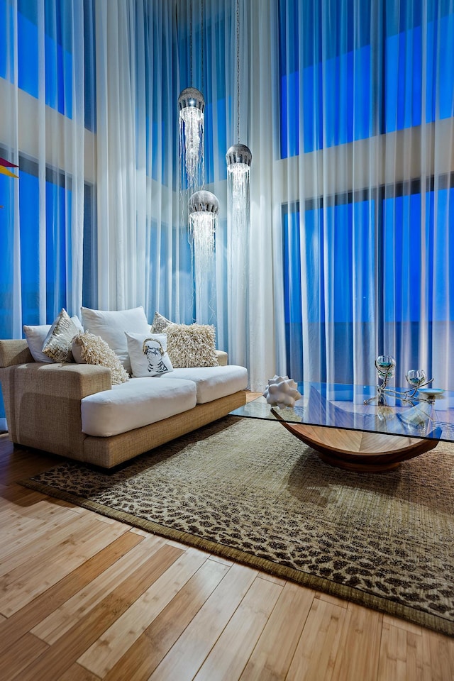 sitting room with wood-type flooring