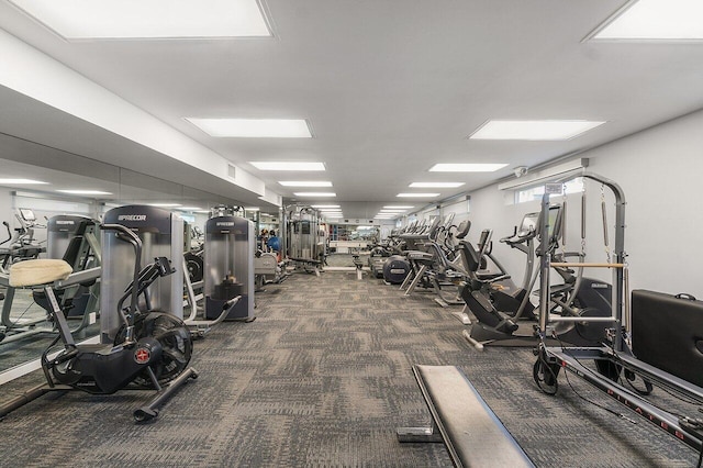 workout area with dark carpet