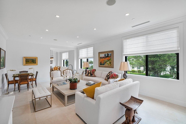 living room featuring a wealth of natural light and ornamental molding