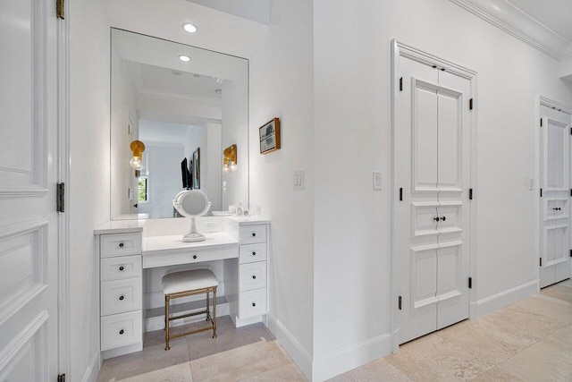 bathroom with tile patterned flooring, vanity, and ornamental molding