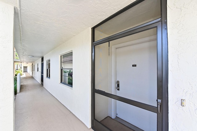 9170 SW 14th St Unit 4107, Boca Raton, FL 33428 - doorway to property featuring stucco siding