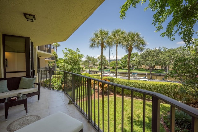 balcony featuring a water view