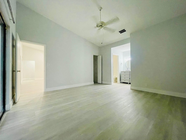 unfurnished room with light hardwood / wood-style flooring, ceiling fan, and vaulted ceiling