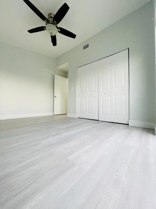 unfurnished bedroom with a closet and ceiling fan