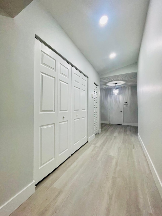 hall with light hardwood / wood-style floors