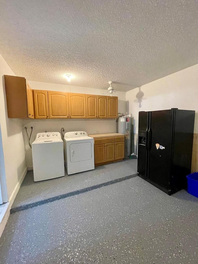 interior space with water heater, cabinets, independent washer and dryer, and a textured ceiling