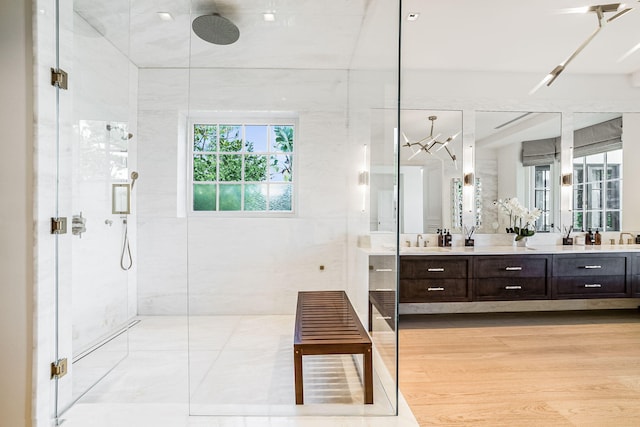 bathroom featuring vanity, hardwood / wood-style floors, and walk in shower