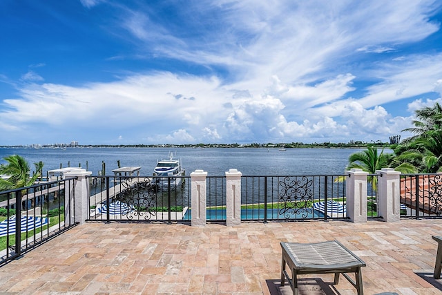 view of patio with a water view