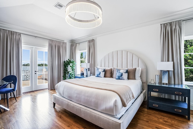 bedroom featuring multiple windows, crown molding, access to exterior, and french doors