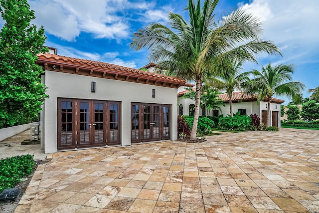 back of house featuring french doors and a patio