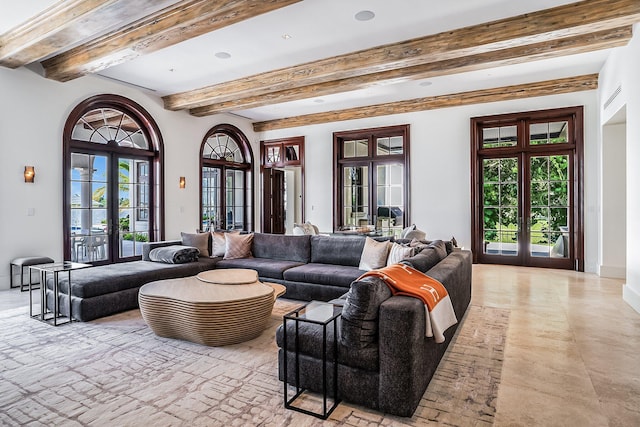 living room featuring beamed ceiling and french doors