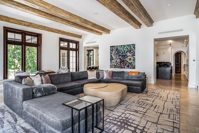 living room with beamed ceiling