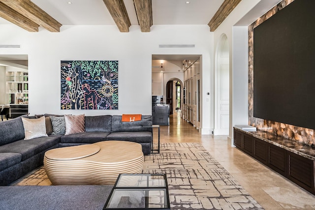 living room featuring beam ceiling