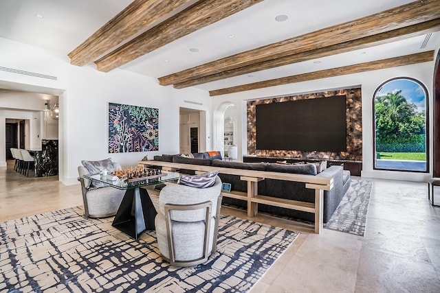 living room with beam ceiling