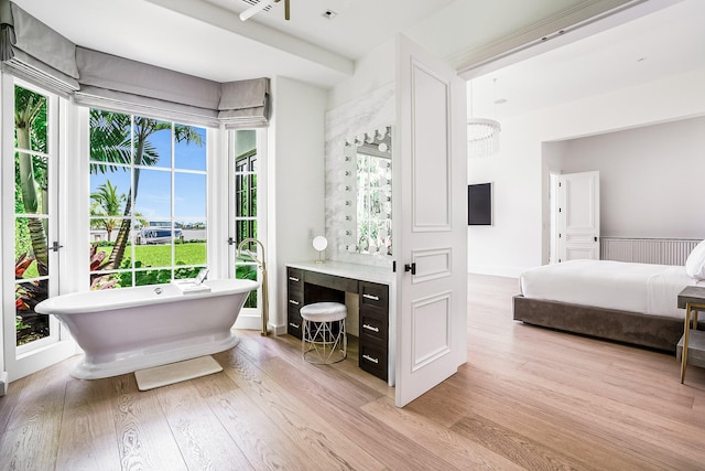 bathroom with a bathtub and wood-type flooring