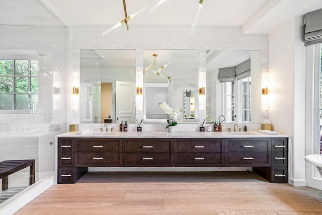 bathroom featuring vanity, hardwood / wood-style floors, and a shower