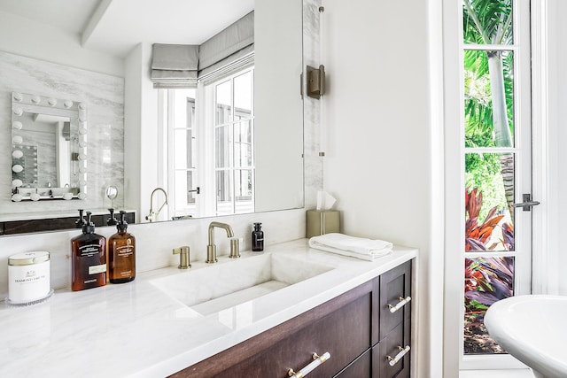 bathroom featuring vanity and a wealth of natural light