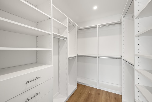 walk in closet featuring hardwood / wood-style floors