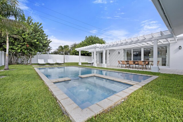 back house at dusk featuring a pergola, a patio, and a lawn