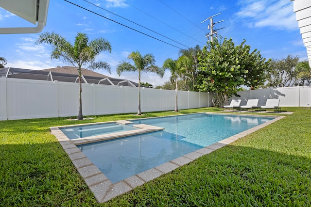 view of swimming pool with an in ground hot tub and a lawn