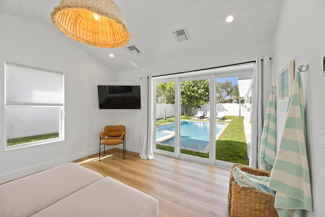 bedroom featuring vaulted ceiling, light hardwood / wood-style flooring, access to exterior, and wood ceiling