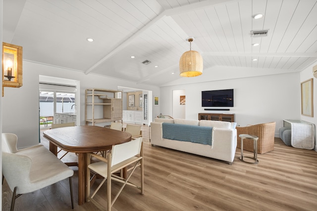 dining room with wood ceiling, hardwood / wood-style flooring, and lofted ceiling with beams