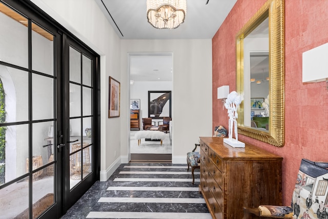 hall with french doors and an inviting chandelier