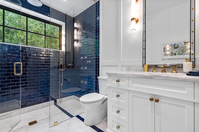 bathroom with vanity, toilet, and walk in shower