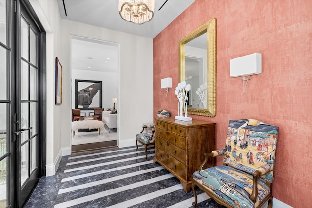 entrance foyer with plenty of natural light and a notable chandelier