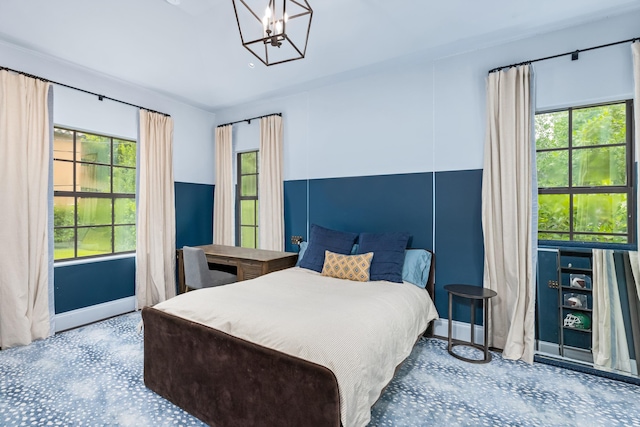 bedroom with an inviting chandelier