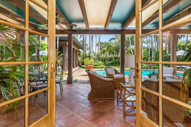 sunroom / solarium with ceiling fan