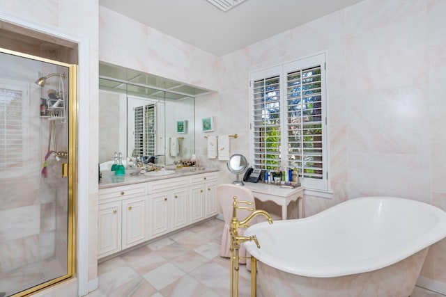 bathroom featuring separate shower and tub and vanity