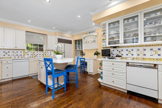 kitchen featuring white cabinets, white dishwasher, tasteful backsplash, and dark hardwood / wood-style floors